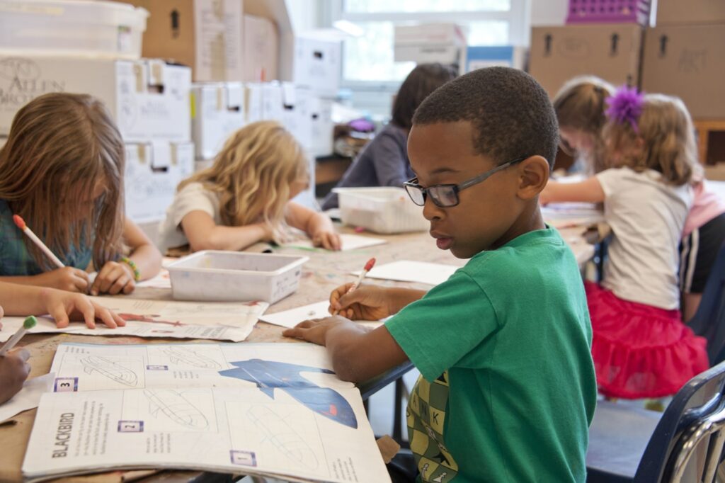 Children reading and writing in class